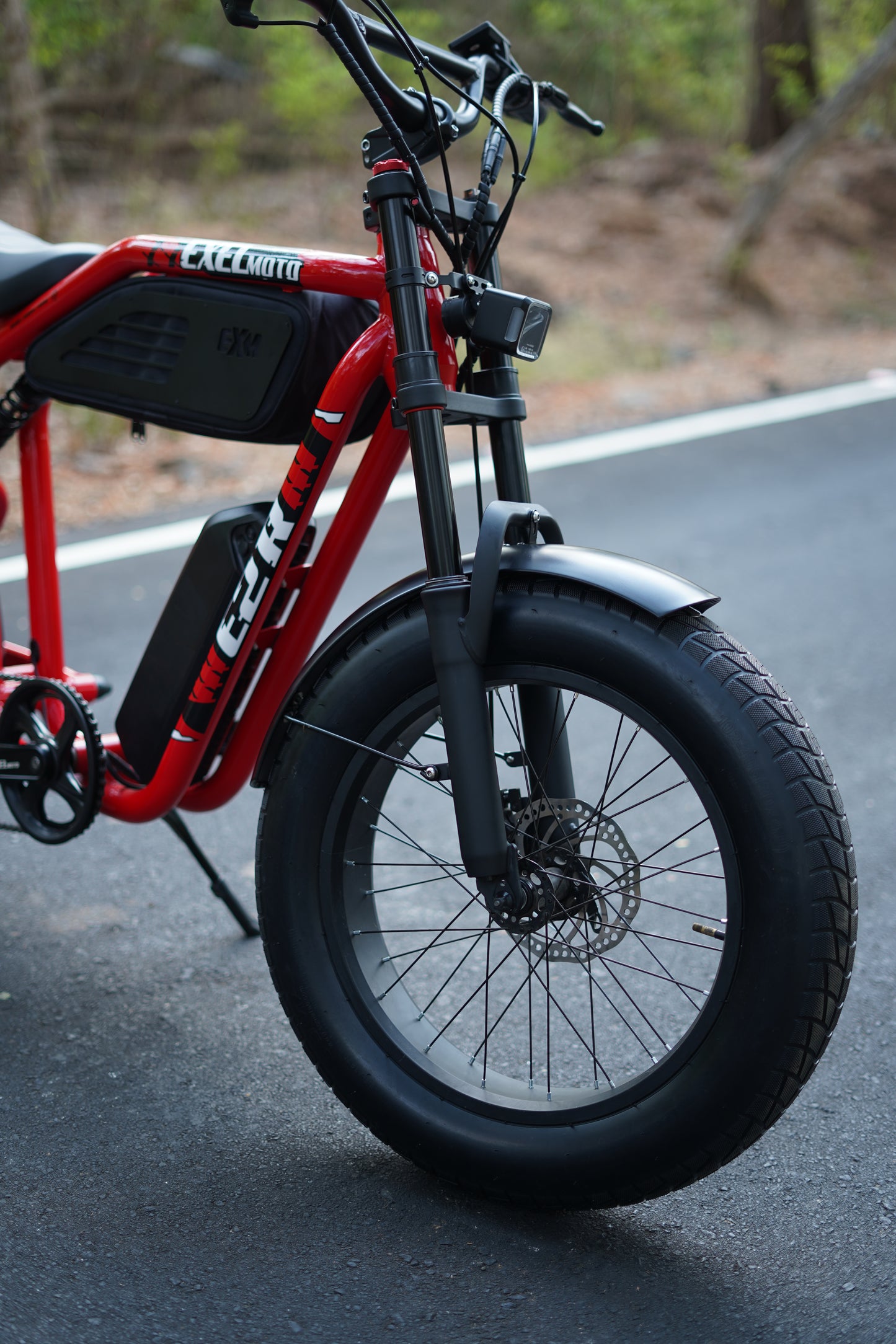 High-resolution photograph inside ExelMoto workshop featuring assembly area
