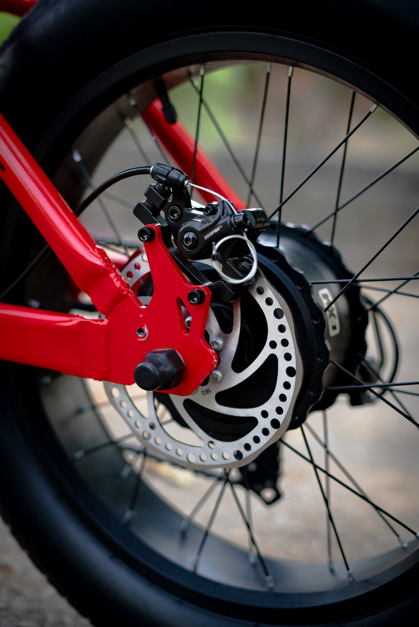 Front angle view of the ExelMoto E2R electric bike showcasing its design