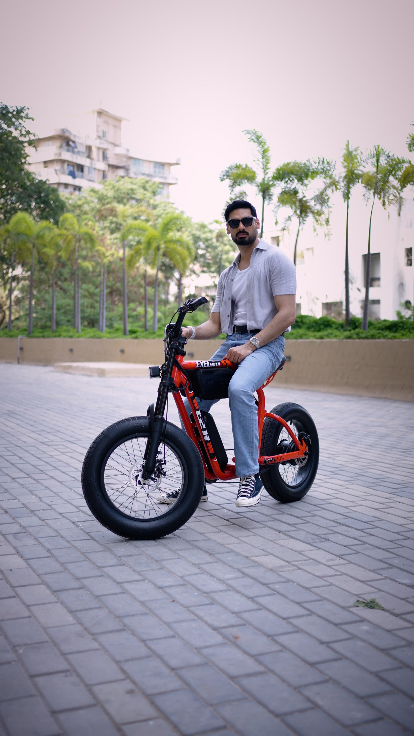 Photo of ExelMoto team or assembly area featuring electric bike setup